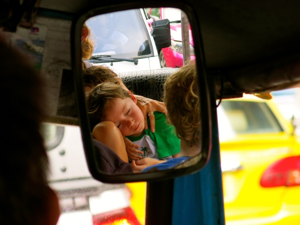 Sleeping babies in Bangkok traffic